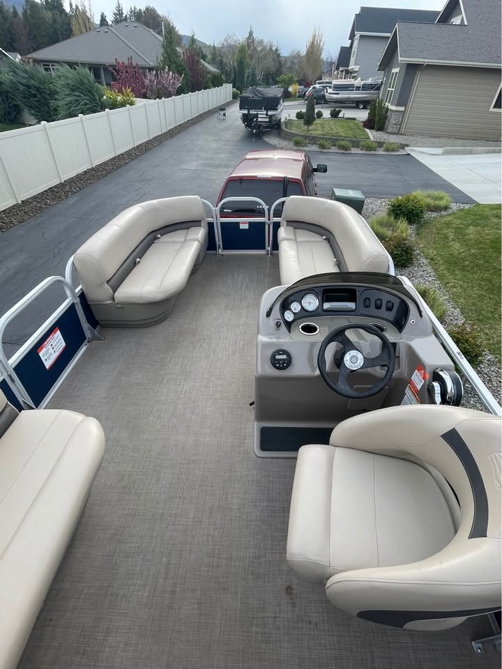 Float Fund helm — steering console and spacious rear seating
