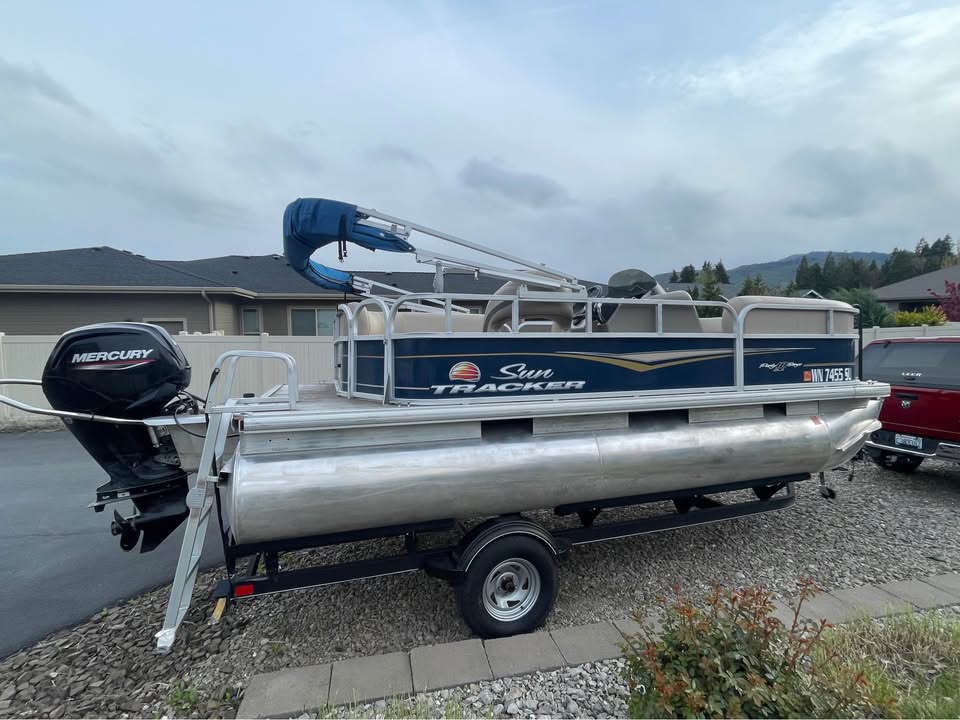 Float Fund exterior — Mercury outboard and swim ladder
